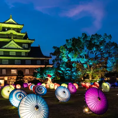 Illuminated Japanese umbrellas and Okayama Castle