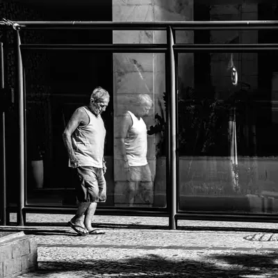 My reflection walks with me