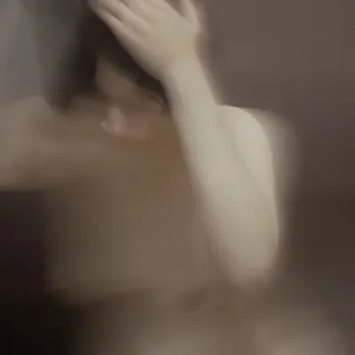 Young woman is washing her hair in the hotel room