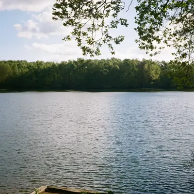 By the water