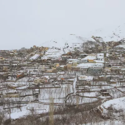 Snow-Covered Village on Mountain