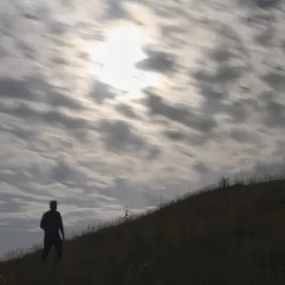 The Wanderer Under Moonlit Clouds