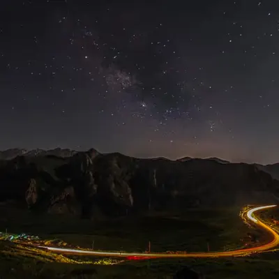Milky Way Over a Winding Road