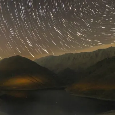 Celestial Symphony Over Tranquil Peaks