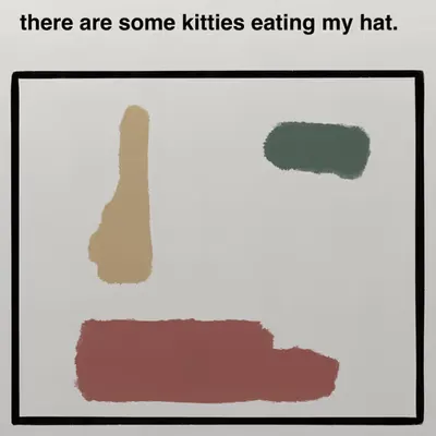 there are some kitties eating my hat.